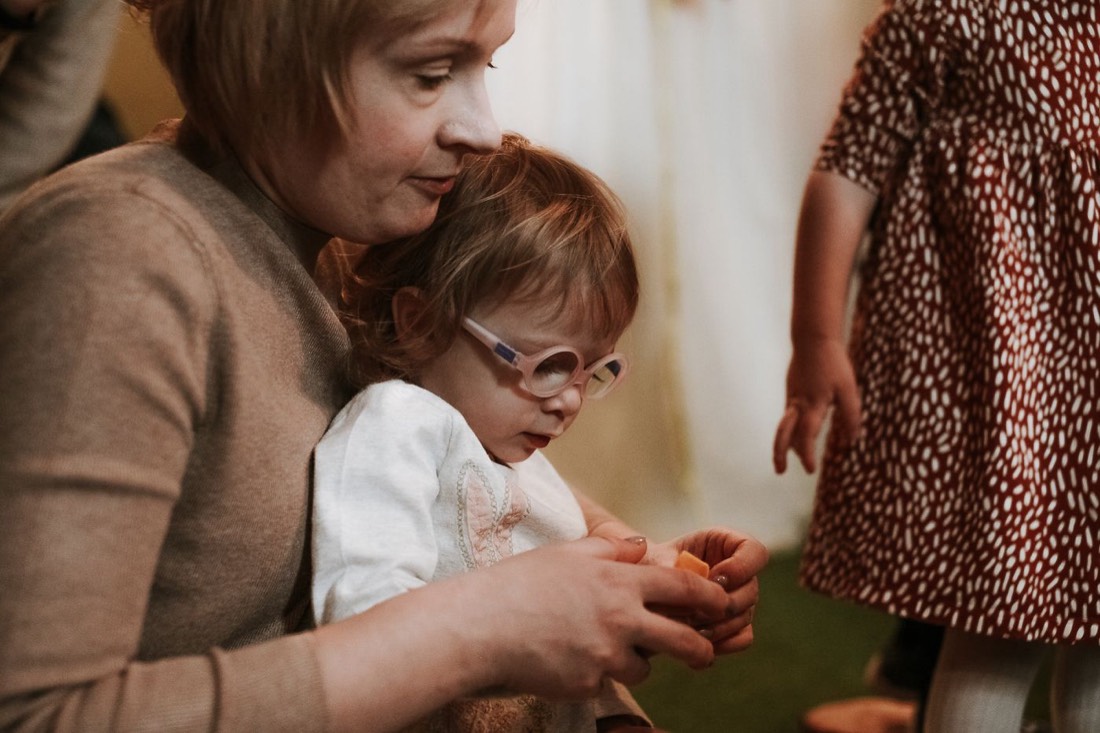 A therapist working closely and patiently with a young child